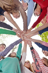 Image showing young friends staying together outdoor in the park