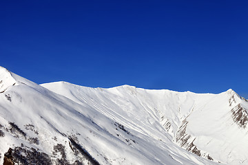 Image showing Snowy mountains at nice sun day