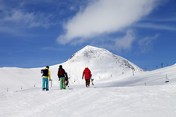 Image showing Three snowboarder on slope at sun nice day