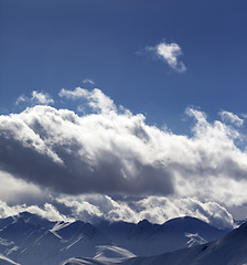 Image showing Evening sunlight mountains in clouds