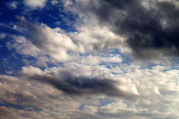 Image showing Blue sky with sunlight and dark clouds