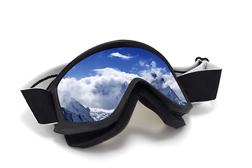 Image showing Ski goggles with reflection of snowy mountains