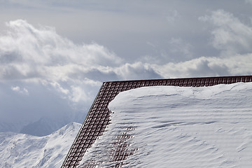 Image showing Roof of hotel in snow and winter mountains