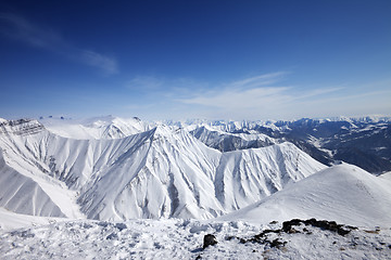 Image showing Snowy mountains at sun day