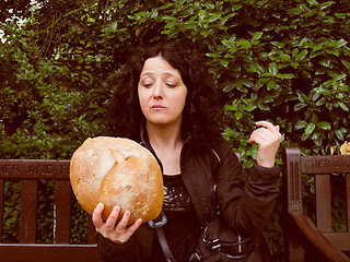 Image showing Girl eating bread