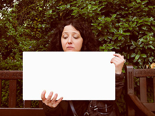 Image showing Girl holding banner