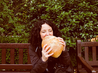 Image showing Girl eating bread