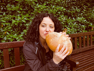 Image showing Girl eating bread