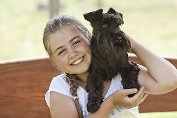 Image showing Young girl with dog