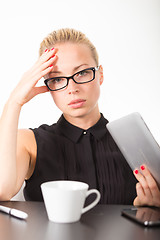 Image showing Business woman working on tablet PC.