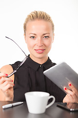 Image showing Business woman working on tablet PC.