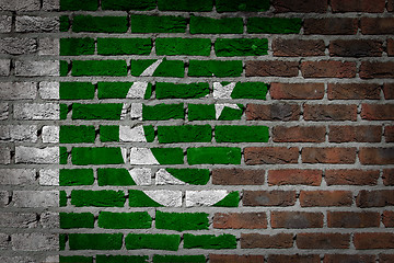 Image showing Brick wall texture with flag