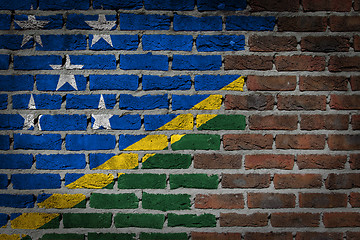 Image showing Brick wall texture with flag