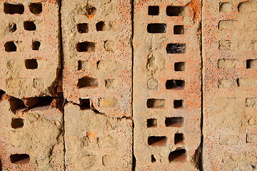 Image showing Four old bricks on a row