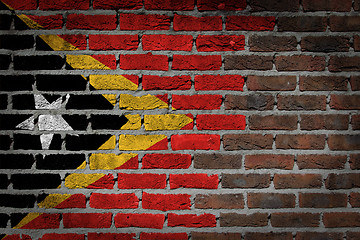 Image showing Brick wall texture with flag