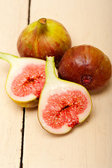 Image showing fresh figs on a rustic table