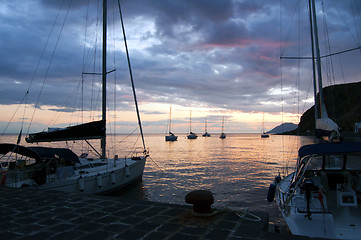 Image showing Sailing boats and sunset