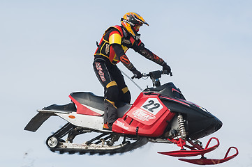 Image showing High jump of sportsman on snowmobile