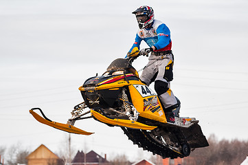 Image showing High jump of sportsman on snowmobile