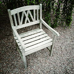 Image showing Old wooden chair in the garden