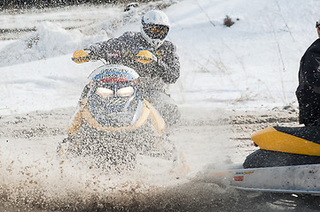 Image showing Snowmobile moves on bend of sport track