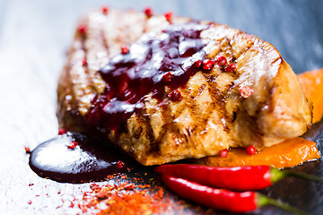 Image showing Deer steak with cranberries sauce