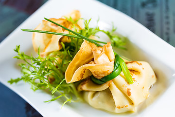 Image showing pancakes with meat decorated green onions