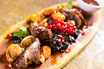 Image showing lamb roast with plums