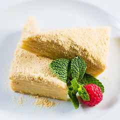 Image showing Cake Napoleon of puff pastry with sour cream on a plate.