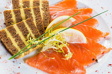 Image showing Salmon snack on the white plate,