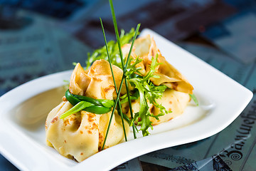 Image showing pancakes with meat decorated green onions