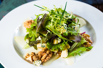 Image showing Fresh organic vegetable salad on whte plate. 