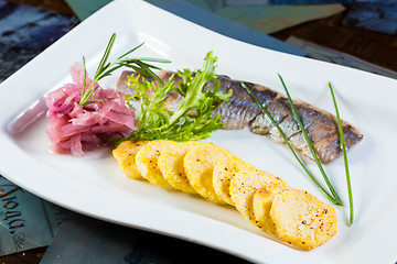 Image showing Herring with fried potatoes and red onions