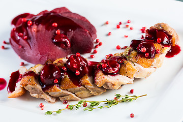 Image showing Roasted duck breast with cranberry sauce