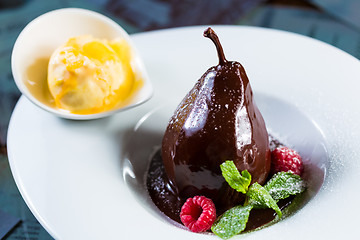 Image showing pears in the chocolate