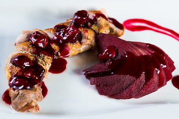 Image showing Roasted duck breast with cranberry sauce