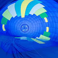 Image showing Fire heats the air inside a hot air balloon at balloon festival 