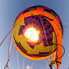 Image showing Fire heats the air inside a hot air balloon at balloon festival 