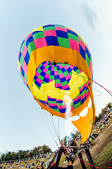 Image showing Fire heats the air inside a hot air balloon at balloon festival 