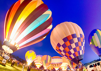 Image showing Bright Hot Air Balloons Glowing at Night