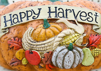 Image showing happy harvest words on a pumpkin craft 