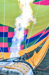 Image showing Fire heats the air inside a hot air balloon at balloon festival 