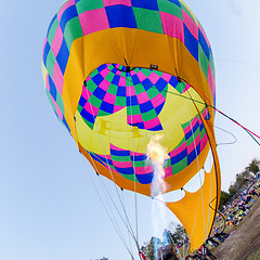 Image showing Fire heats the air inside a hot air balloon at balloon festival 