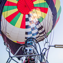 Image showing Fire heats the air inside a hot air balloon at balloon festival 