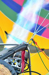 Image showing Fire heats the air inside a hot air balloon at balloon festival 