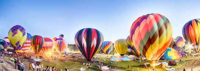 Image showing Bright Hot Air Balloons Glowing at Night