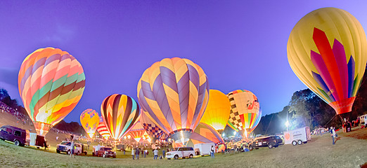 Image showing Bright Hot Air Balloons Glowing at Night