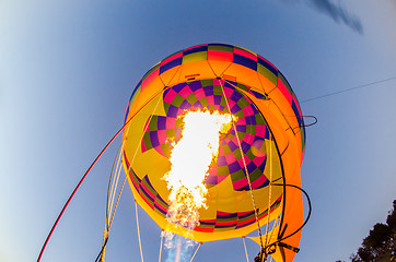 Image showing Fire heats the air inside a hot air balloon at balloon festival 