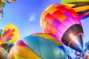 Image showing Bright Hot Air Balloons Glowing at Night