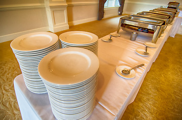 Image showing Chafing Dish and glass plates  at buffet